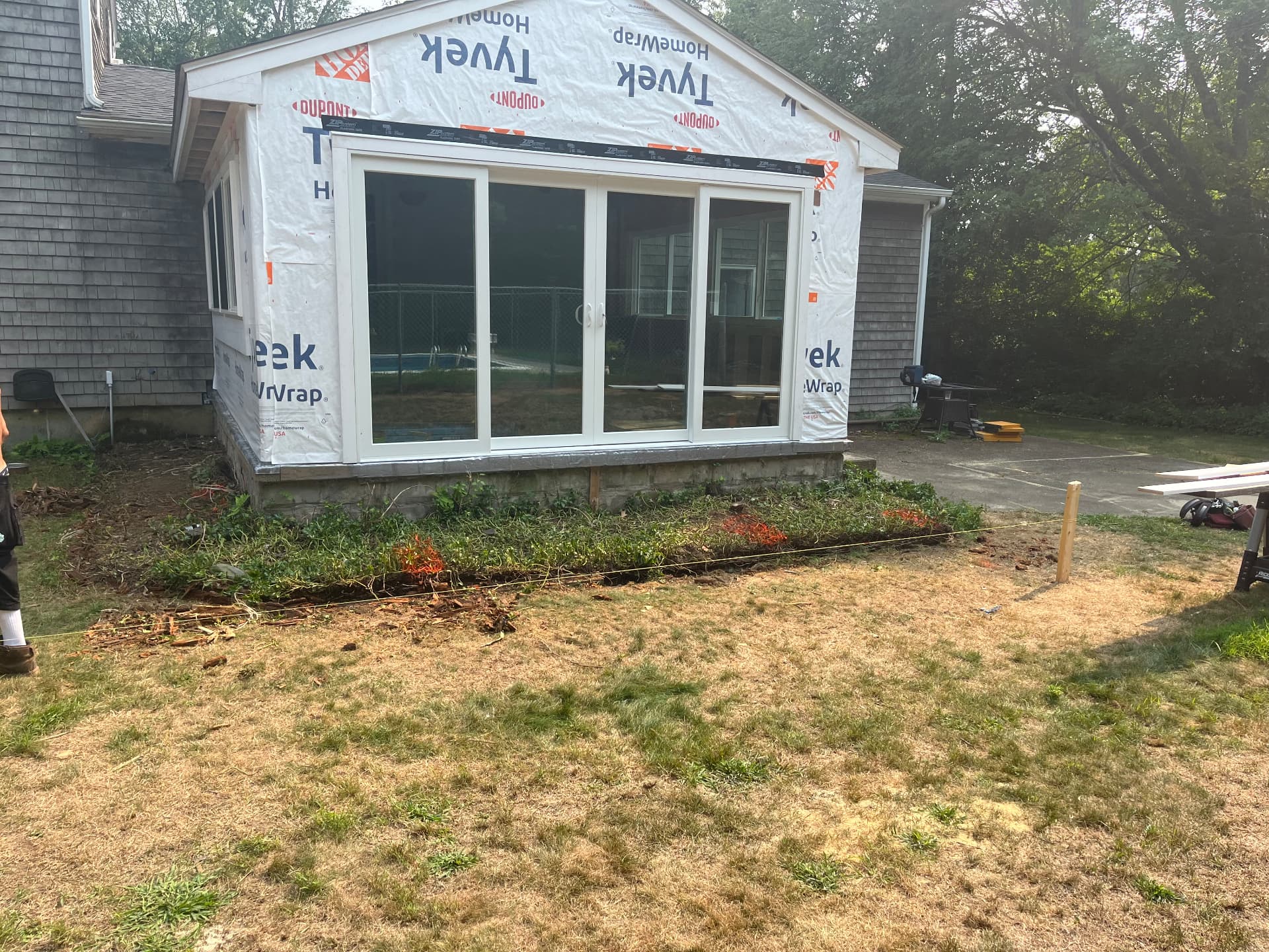 136 Rustic Acres — framed sunroom addition with new sliders